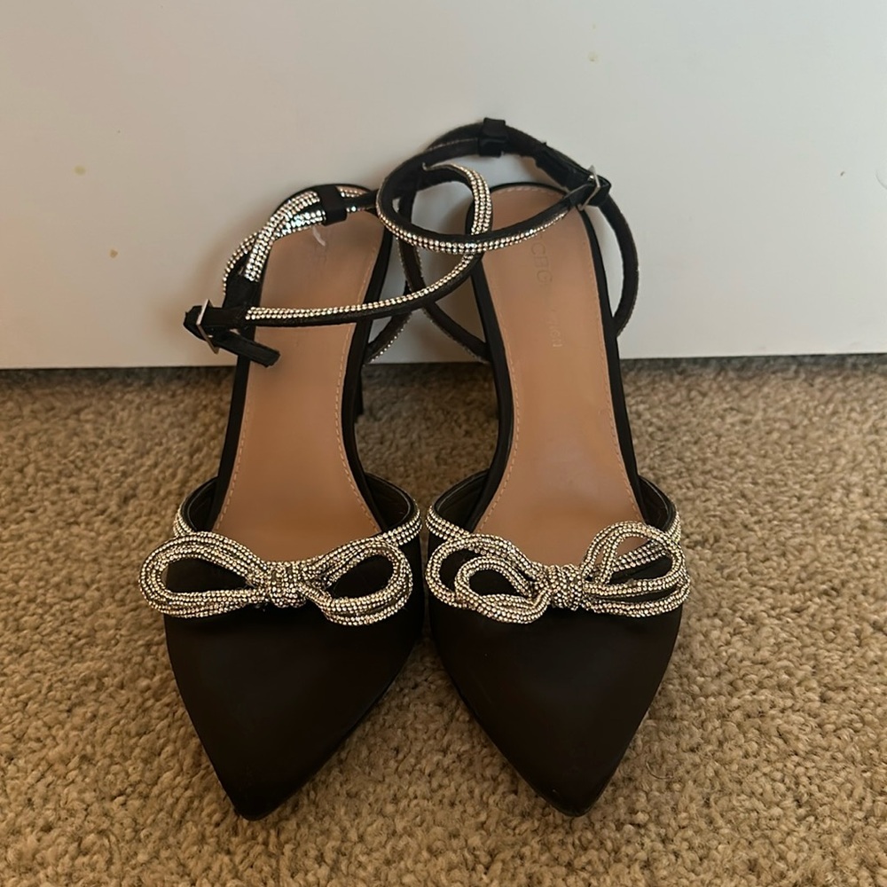 Strappy black and sparkly bow heels